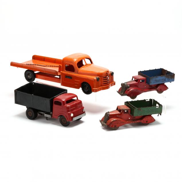 FOUR VINTAGE TOY TRUCKS The first