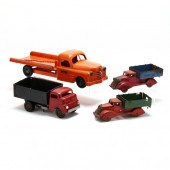 FOUR VINTAGE TOY TRUCKS The first is