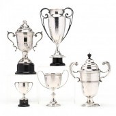 A GROUPING OF FIVE SILVERPLATE TROPHIES