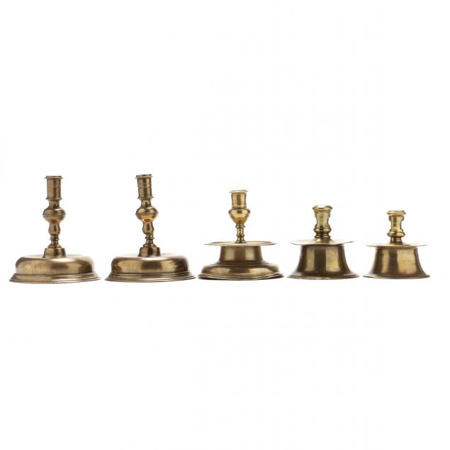 FIVE EARLY CONTINENTAL BRASS CANDLESTICKS 346f28