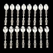 A SET OF SIXTEEN STERLING SILVER SPOONS