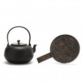 A JAPANESE IRON KETTLE AND BRONZE MIRROR