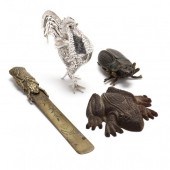 A GROUPING OF FOUR METAL ANIMAL ACCESSORIES