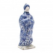 A BLUE AND WHITE DELFT FIGURE OF A LADY