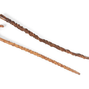 Two Folk Art Carved Walking Sticks comprising 34ddd0