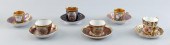 SIX PORCELAIN DEMITASSE CUPS AND SAUCERS