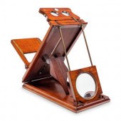 A Mahogany and Brass Optometrists Tool
Height