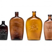 Four Molded Glass Amber Flasks
American,