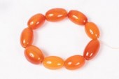 An orange agate bead bracelet of nine