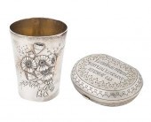 A RUSSIAN SILVER MONEY PURSE AND CUP,