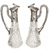A PAIR OF SILVER-MOUNTED CUT GLASS DECANTERS,
