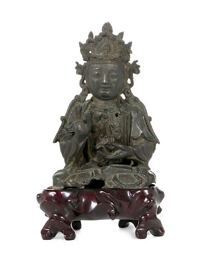 A CHINESE BRONZE FIGURE OF A SEATED 384fb6