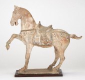 A GLAZED TANG DYNASTY HORSE, CHINAA