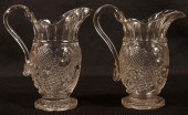 TWO COLORLESS FLINT GLASS CREAM PITCHERS.Two