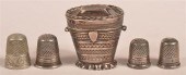 SILVER THIMBLE CASE AND FOUR VARIOUS