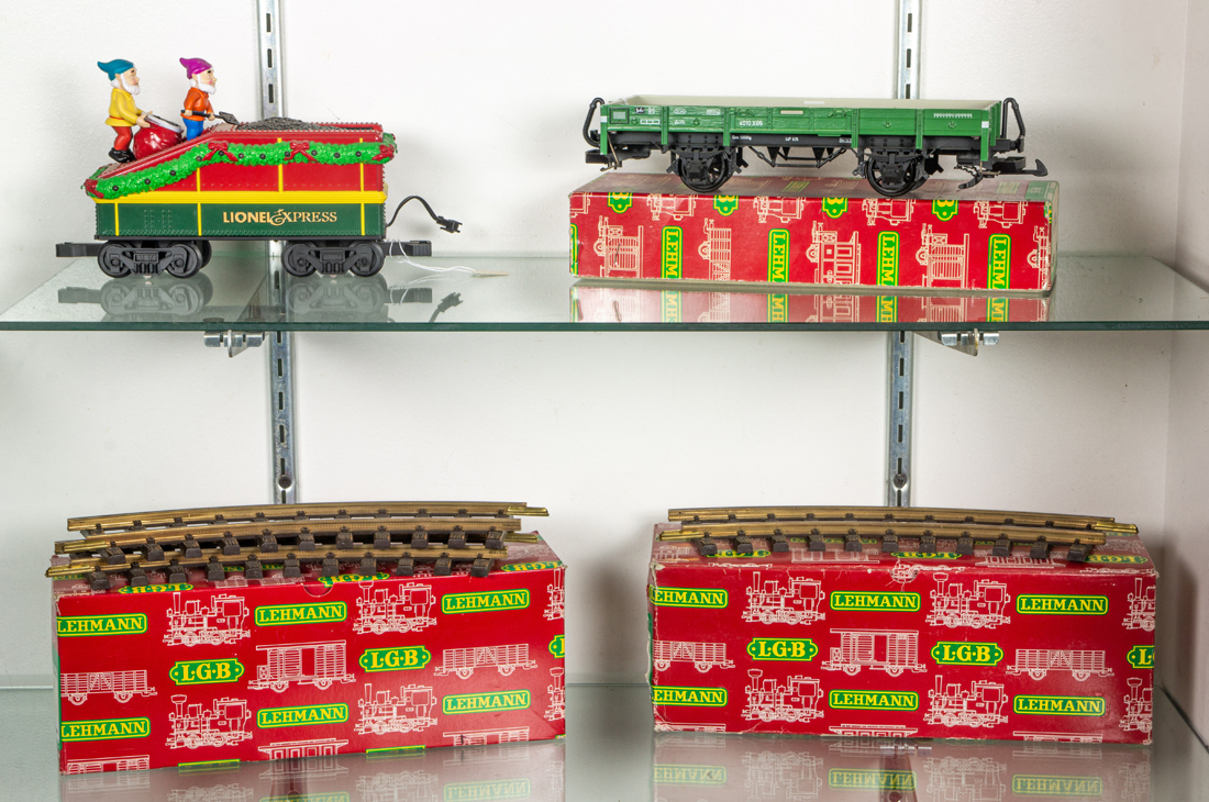 TWO SHELVES OF TOY TRAINS AND TRACKS 3a1ea1