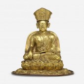 . seated figure of Karmapa. gilt bronze.