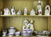 TWO SHELVES OF PORCELAIN FIGURINES AND