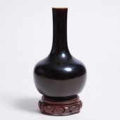 A Small Mirror-Black-Glazed Bottle Vase,