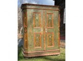 A large antique painted cupboard in