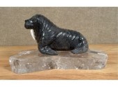 An unsigned grey soapstone walrus with