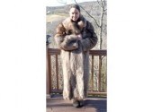 A fox fur coat, labeled Lioudkat Enterprises.