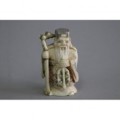 Japanese carved ivory netsuke scholar,