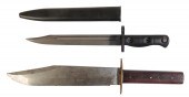 A BOWIE KNIFE with a brass hilt and