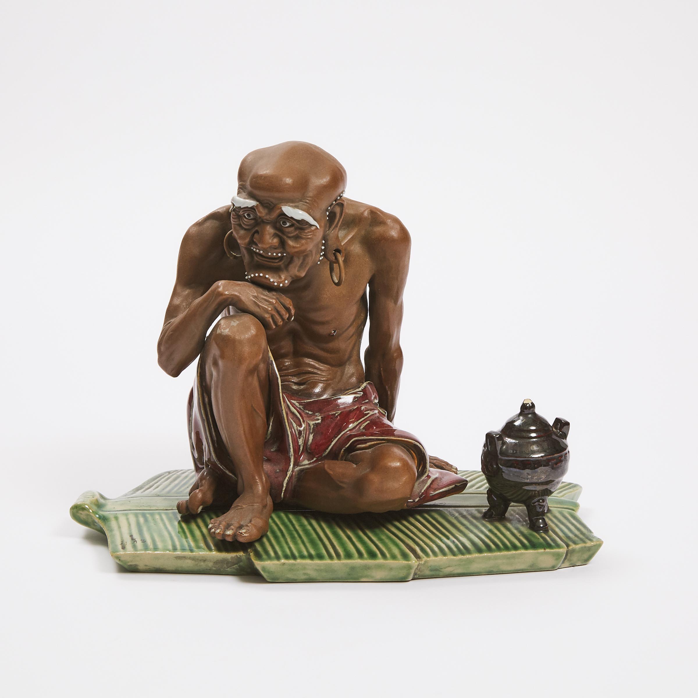 A Shiwan Figure of a Seated Luohan  3ac47f