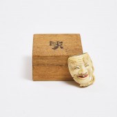 An Ivory Noh Mask Netsuke of Okina (Hakushikijo),