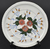 GRANDMA MOSES DECORATED PLATE. A floral