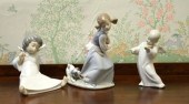 Three Lladro figurines: girl with dog