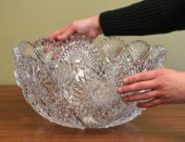 A large antique cut glass punch bowl.