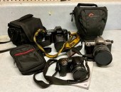Three Nikon cameras and accessories.
