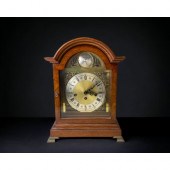 An Oak cased chiming mantel clock Tempus
