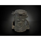 A CARVED BENIN WOODEN HEAD OF AN OBA.