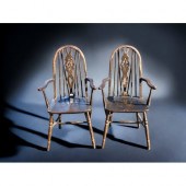 A PAIR OF ERCOL STYLE WHEEL BACK CARVER