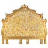 A Giltwood Headboard with Fortuny Upholstery
20th