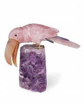 A CARVED STONE TOUCAN FIGURE AND AMETHYST