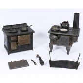 PAIR OF ANTIQUE TOY STOVES WITH POTS,