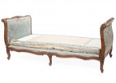 LOUIS XV-STYLE CARVED WALNUT SLEIGH