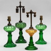 GROUP OF FOUR GREEN GLASS FLUID LAMPSElectrified.

The