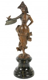 PATINATED BRONZE FIGURE OF A WOMAN WITH