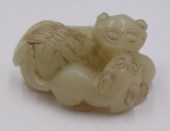 CHINESE CARVED JADE PENDANT OF A LIONESS,