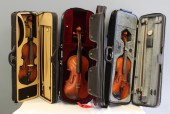 GROUP OF 3 VIOLINS IN SOFT CASES 1)