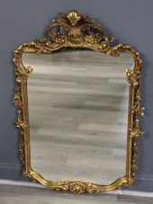 ANTIQUE CARVED AND GILTWOOD MIRROR.