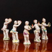 GROUP OF FIVE CHELSEA PORCELAIN PUTTI
