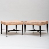 PAIR OF EBONIZED AND UPHOLSTERED THEBES