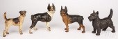FOUR PAINTED CAST IRON DOG DOORSTOPS,