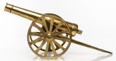 BRASS TABLETOP MODEL OF A CANNON Brass